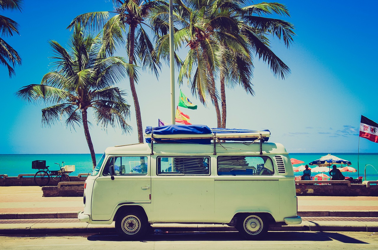 VW bus in front of beach