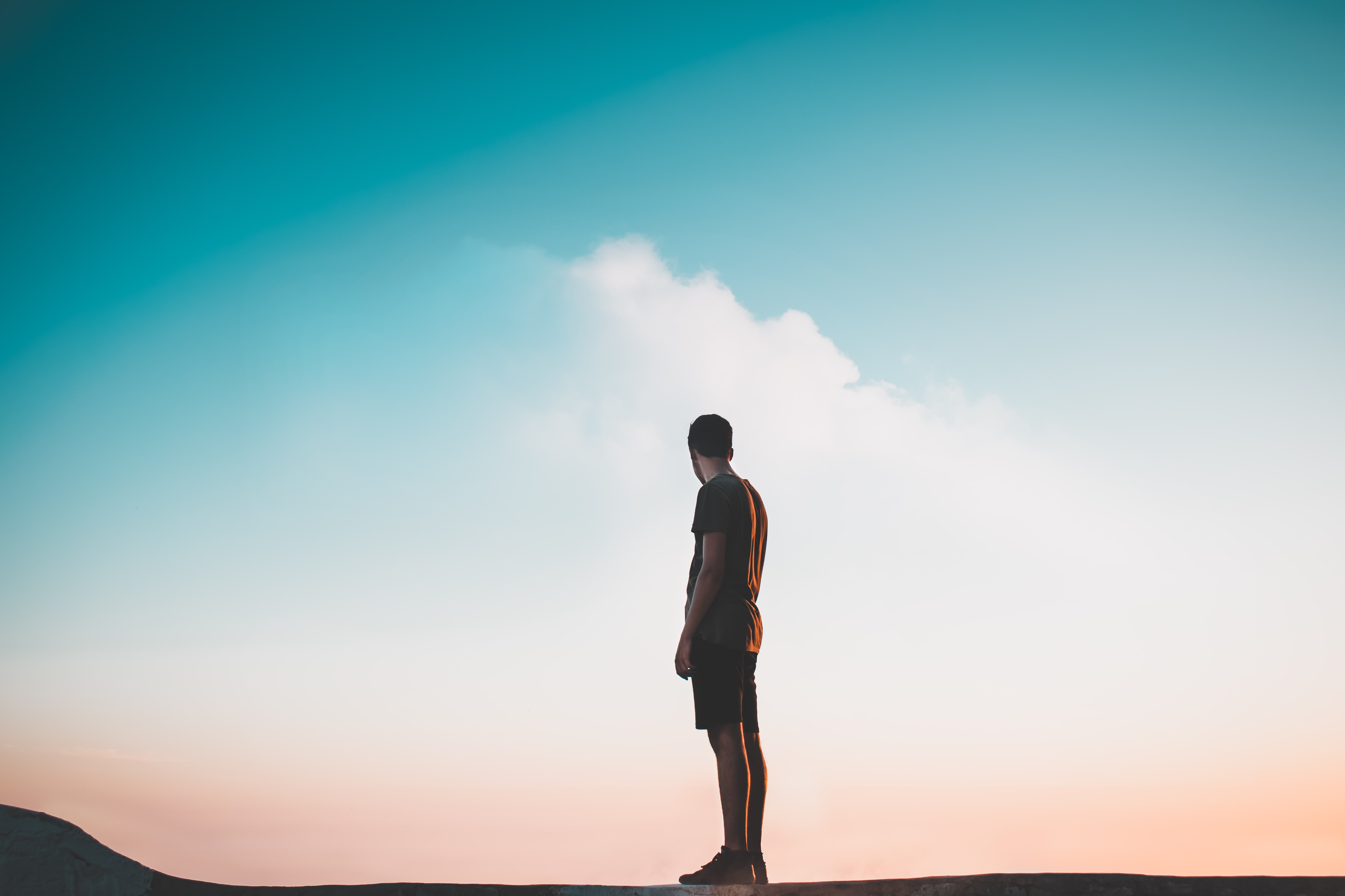 Photo by Kylo on Unsplash.  Photo of man staring off into the distance.