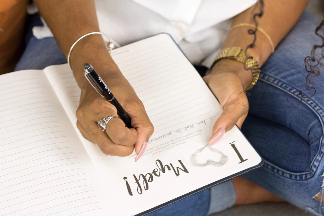 Black Woman Writing in Journal