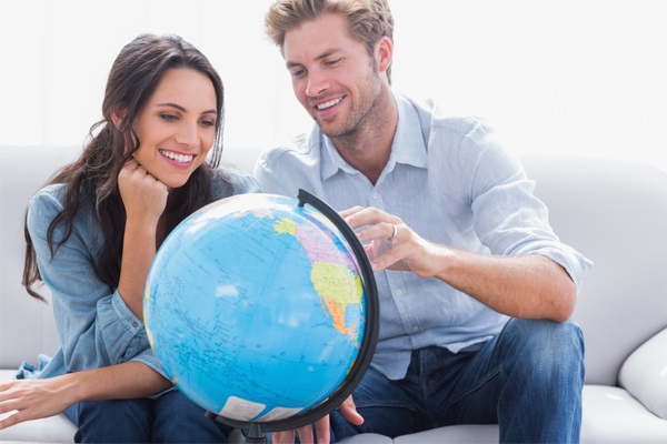 couple looking at a globe
