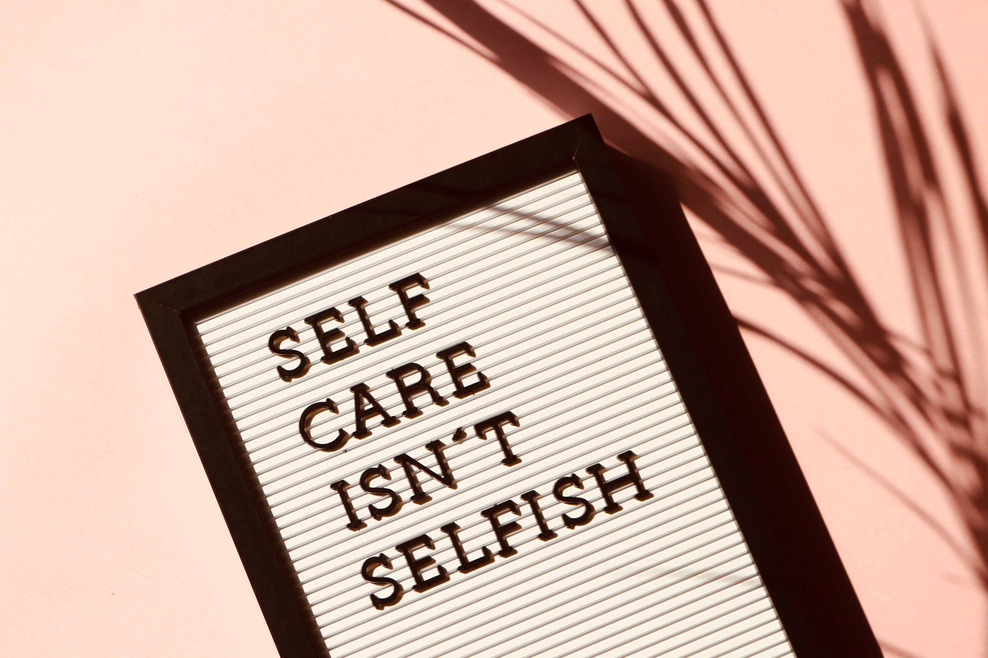 Have a Little Compassion, Will You?, Image of a sign board saying self care isn't selfish
