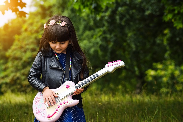 A child with a guitar