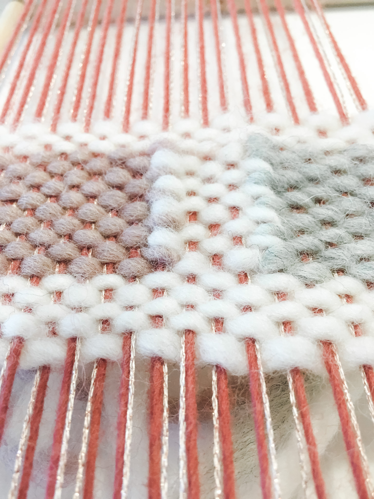 Weaving squares on the loom.