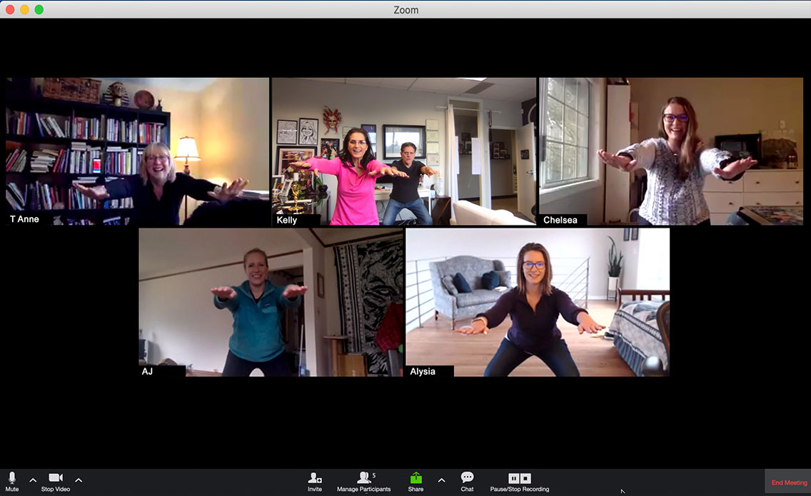 Group of people on a Zoom video call doing squats.