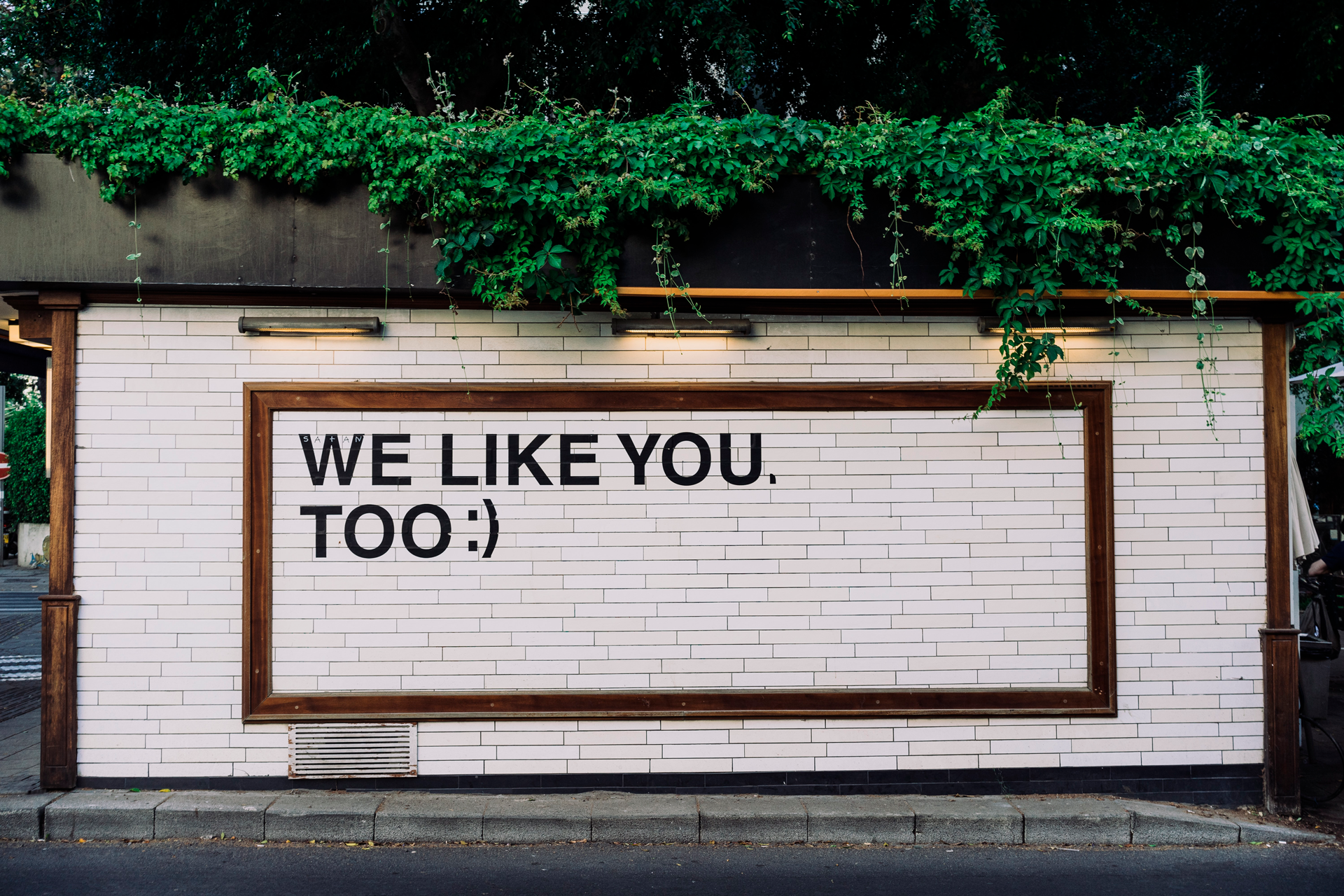 A sign that shows "We like you too" text.