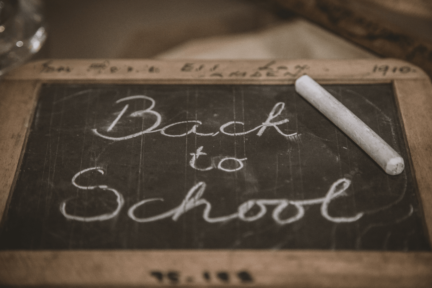 "Back to School" written on a small chalkboard | Learning in Midlife; Once a Luxury, Now a Necessity