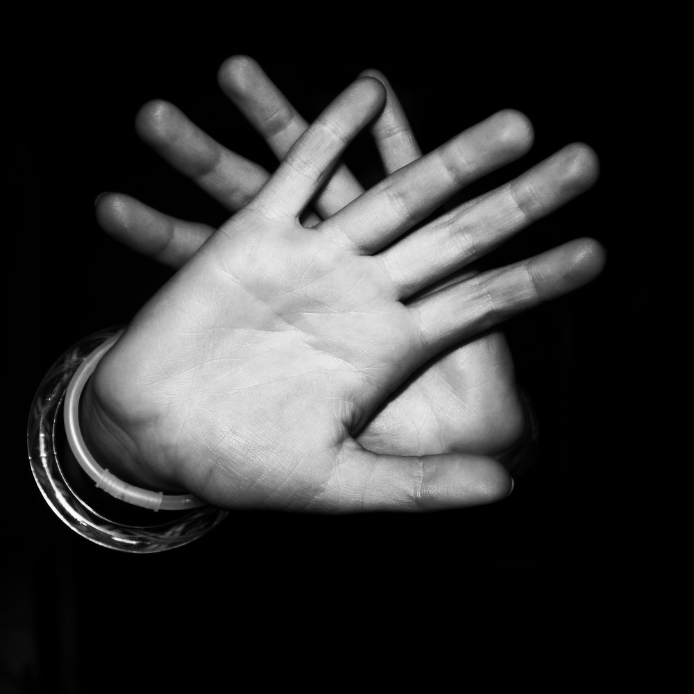 hand pushing away black and white