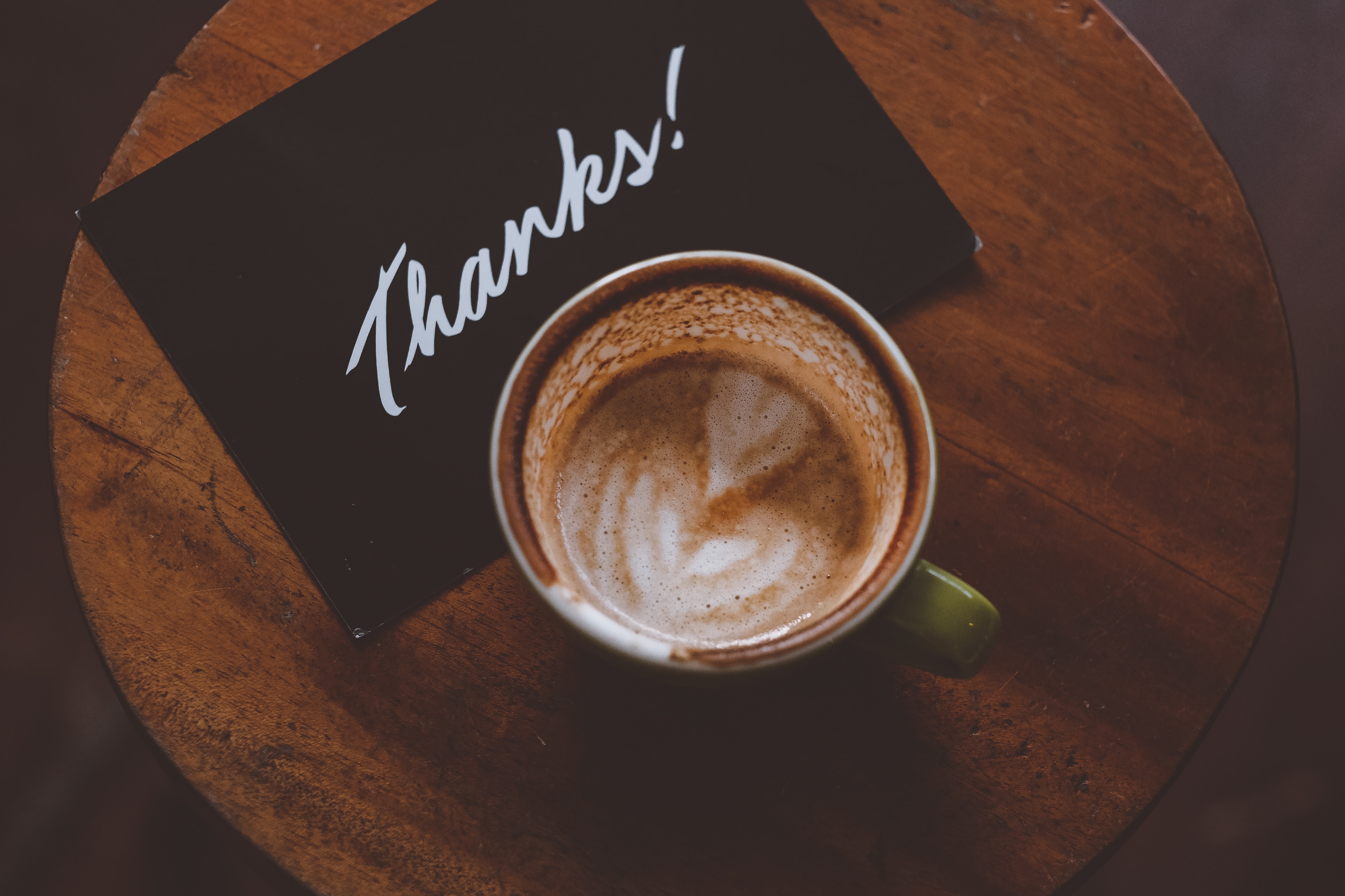 Coffee with a "thanks" sign