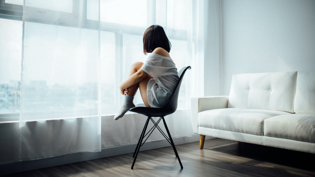 Lead image of woman sitting alone
