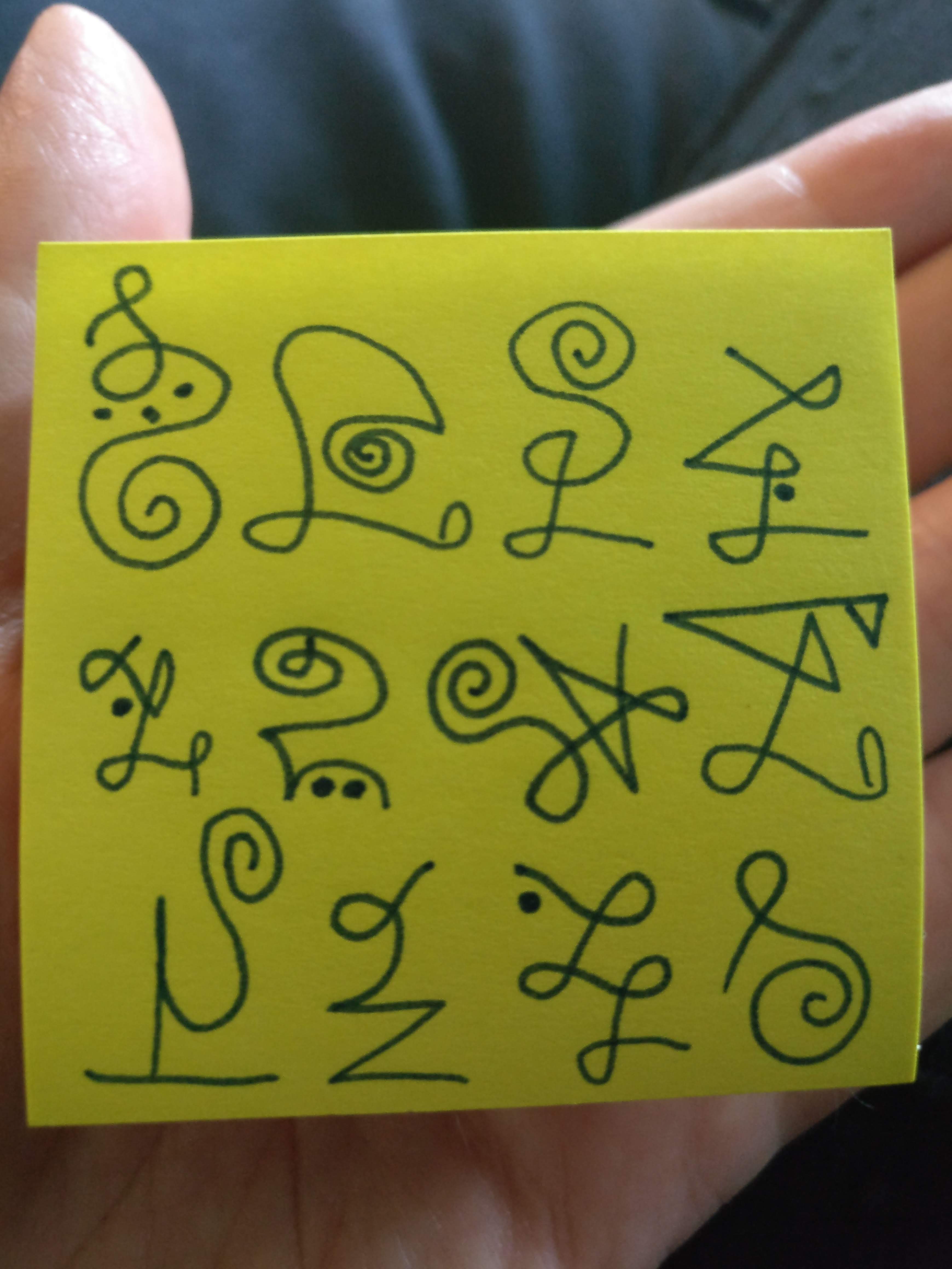 handwritten light language on a small post it note