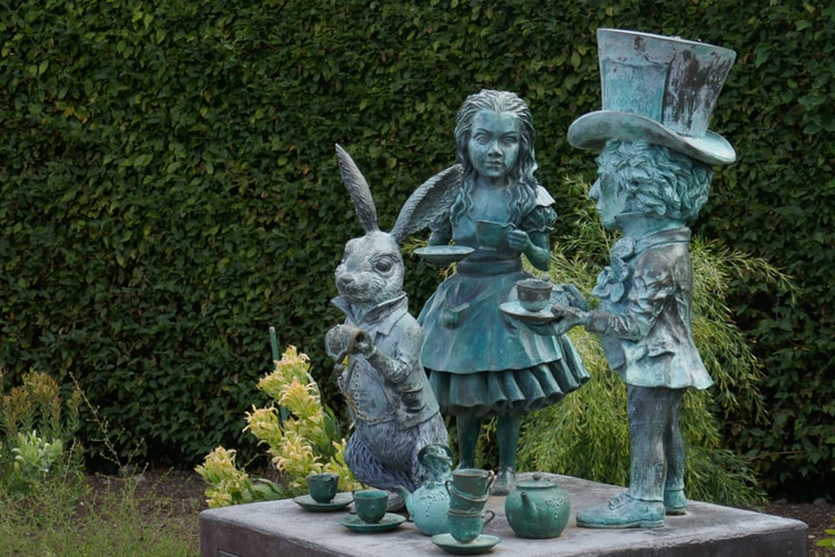 Stone Garden Statues of Alice in Wonderland, the White Rabbit and the Mad Hatter
