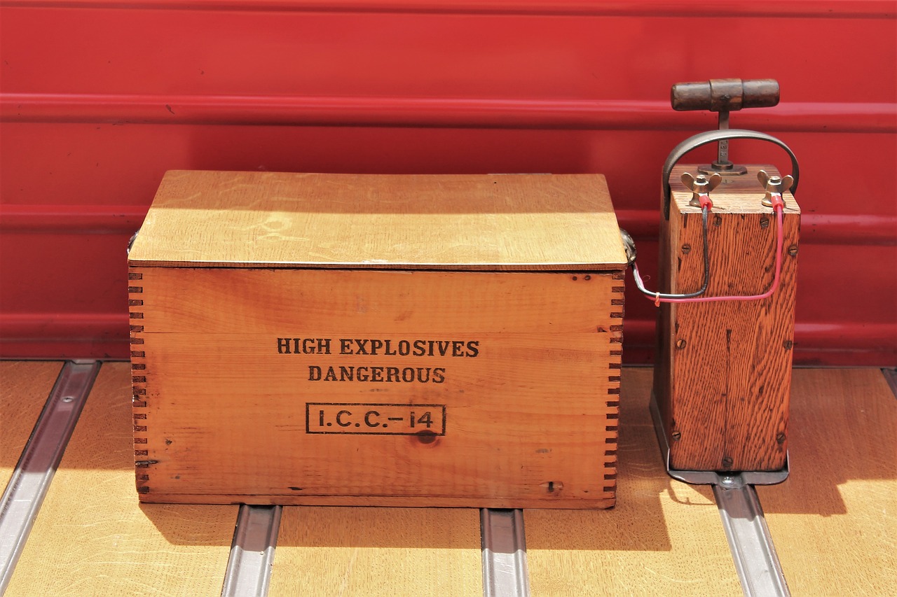 A wooden box of explosives attached to a old style detonator