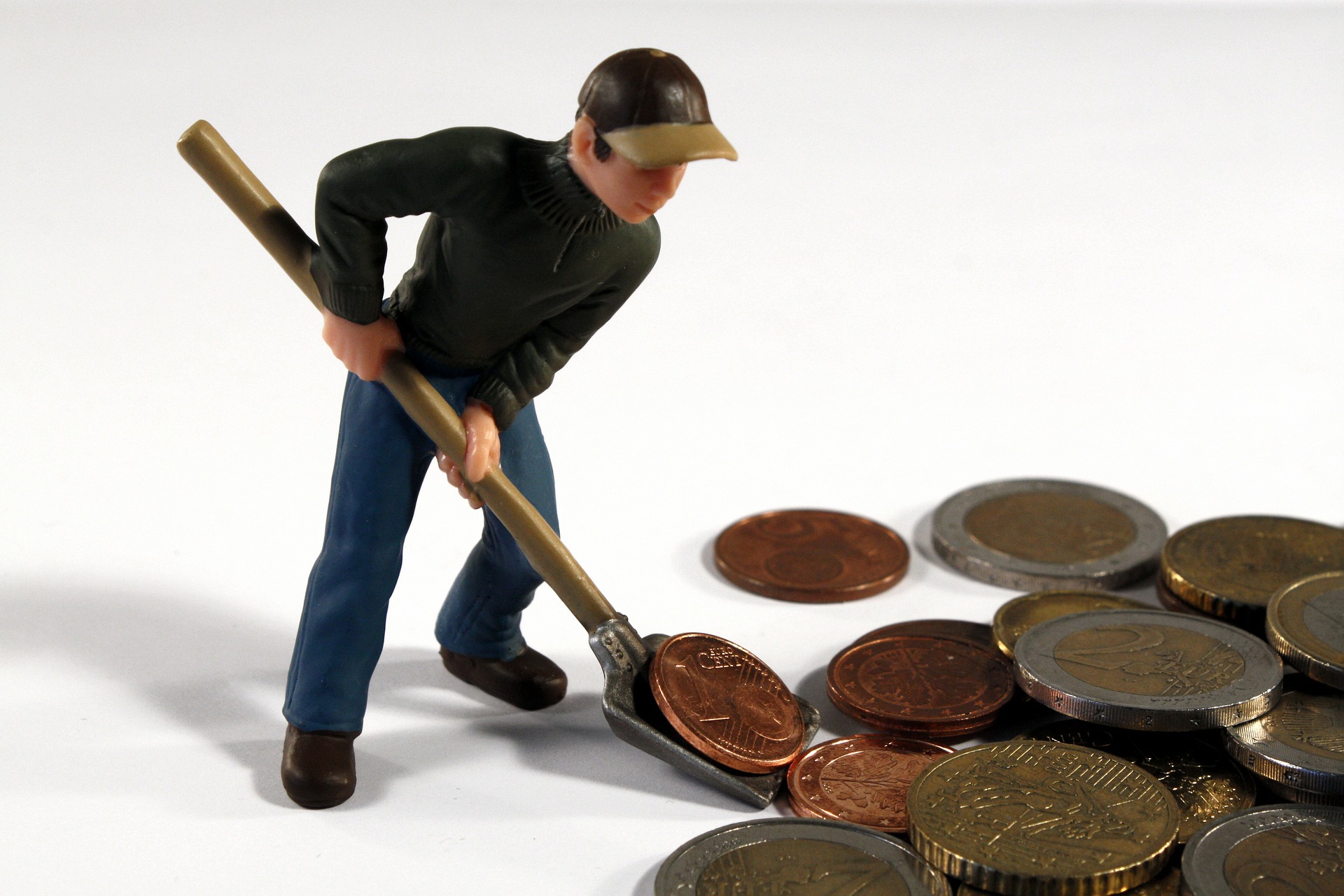 Toy man shoveling pennies.