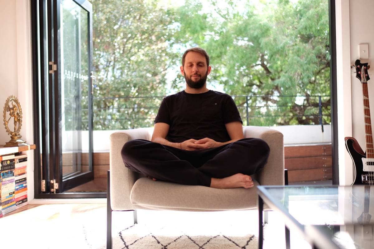 Vedic Meditation teacher Rory Kinsella meditating at home