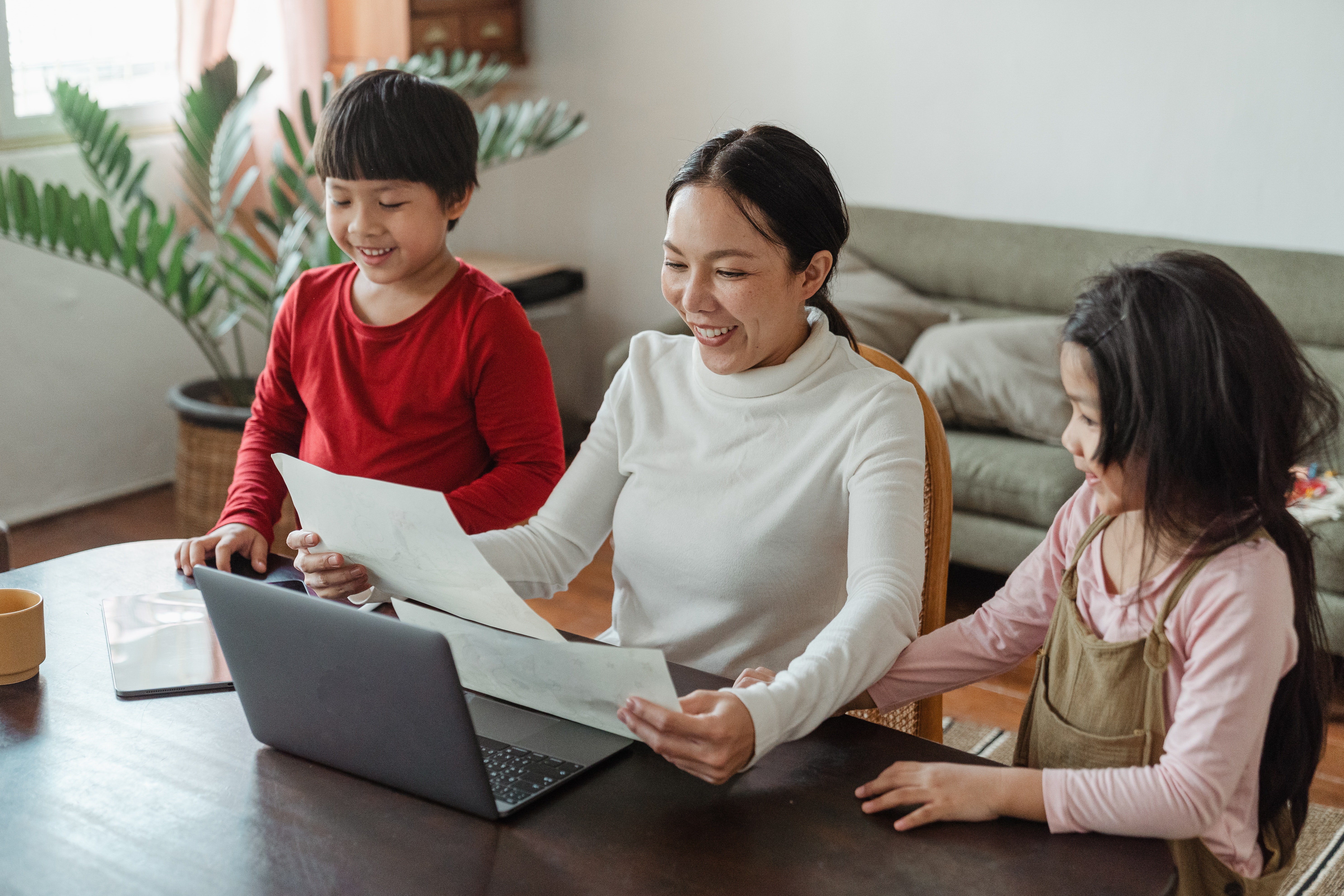 parent working from home with children at table