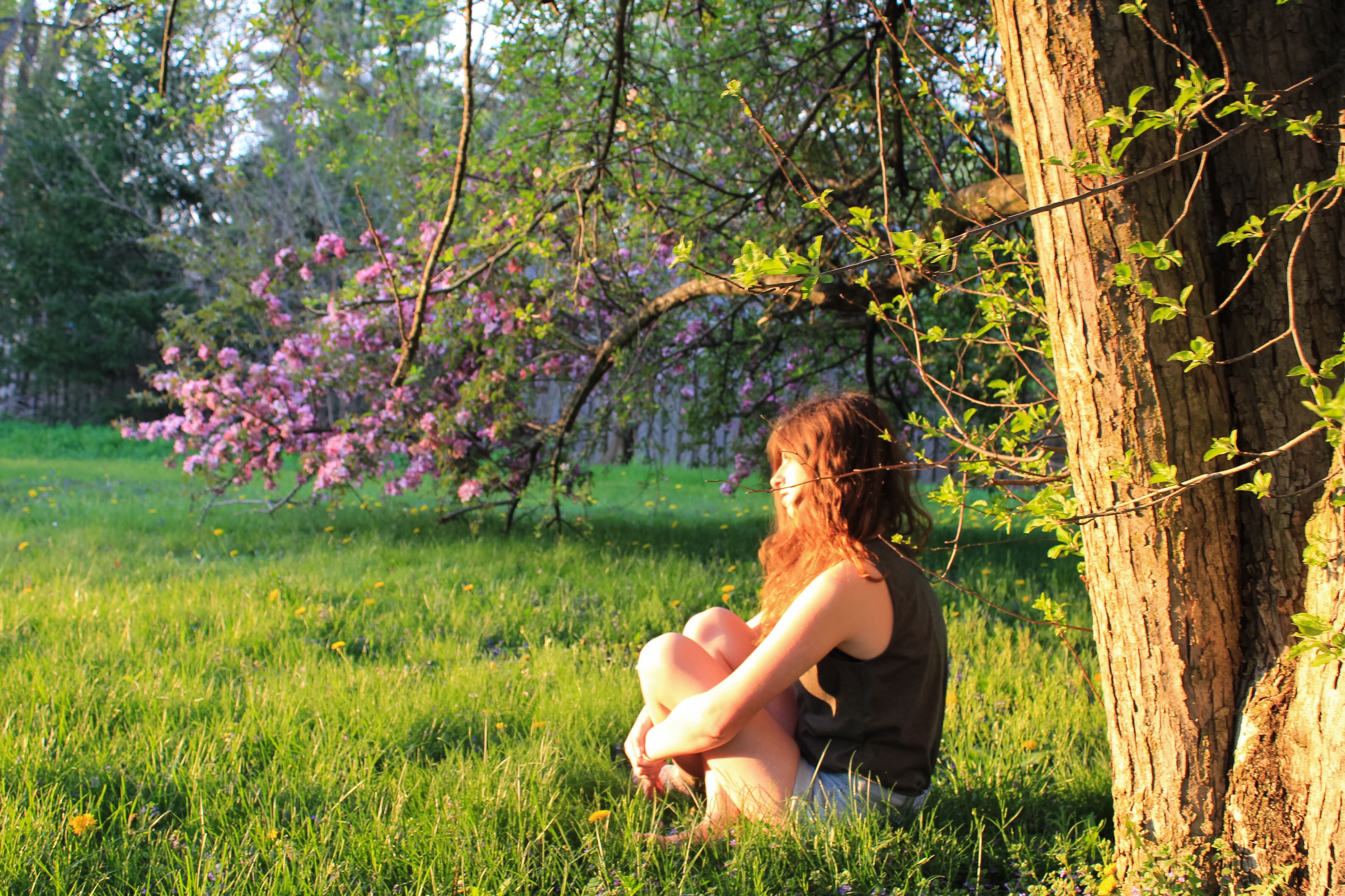 young woman deep in thought in naturer