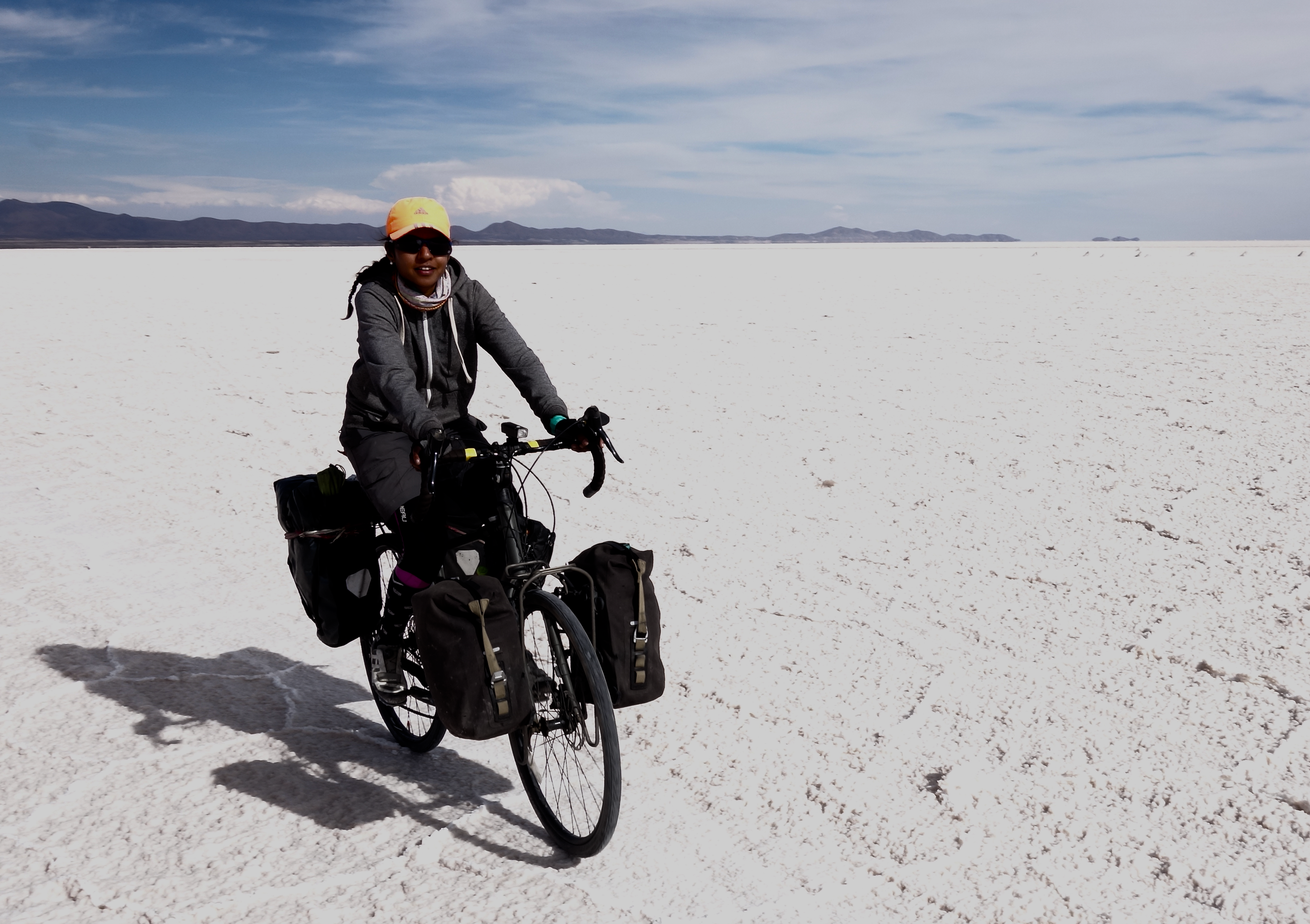 Cycling through the Uyuni Salt Flats in Bolivia, during a 24,000 km bicycle journey from Alaska to Argentina