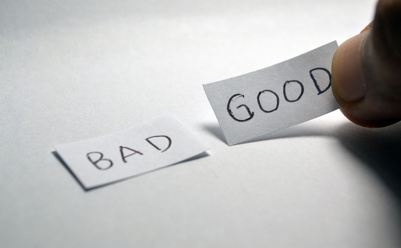 "Bad" and "Good" written in a small piece of paper