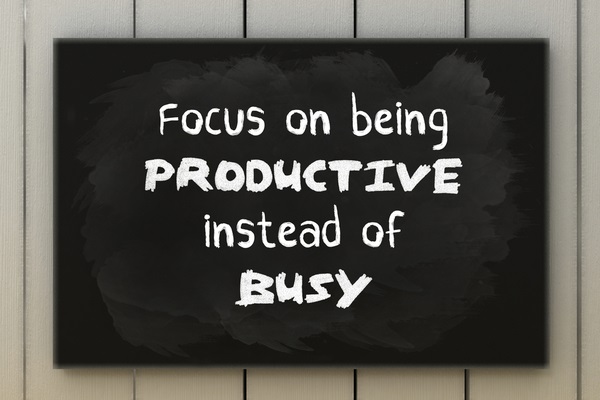 focus on being productive words written on a blackboard