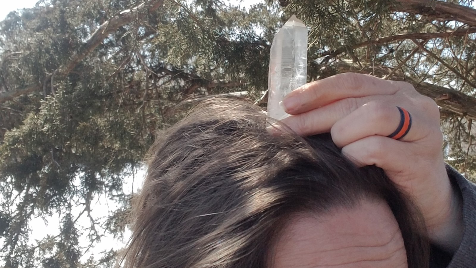 Show how to place quartz point on Crown Chakra