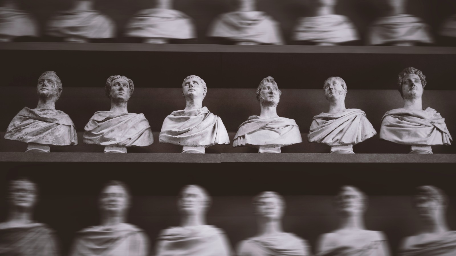 Rows of bust sculptures on shelves