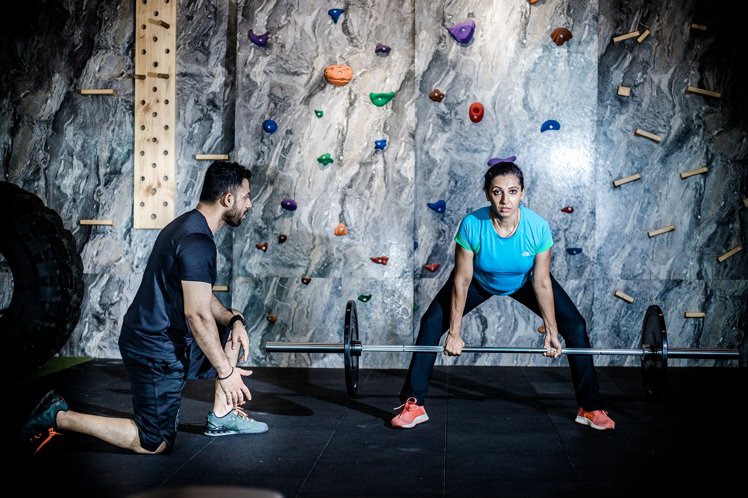 A fitness entrepreneur leading a workout session at sunrise