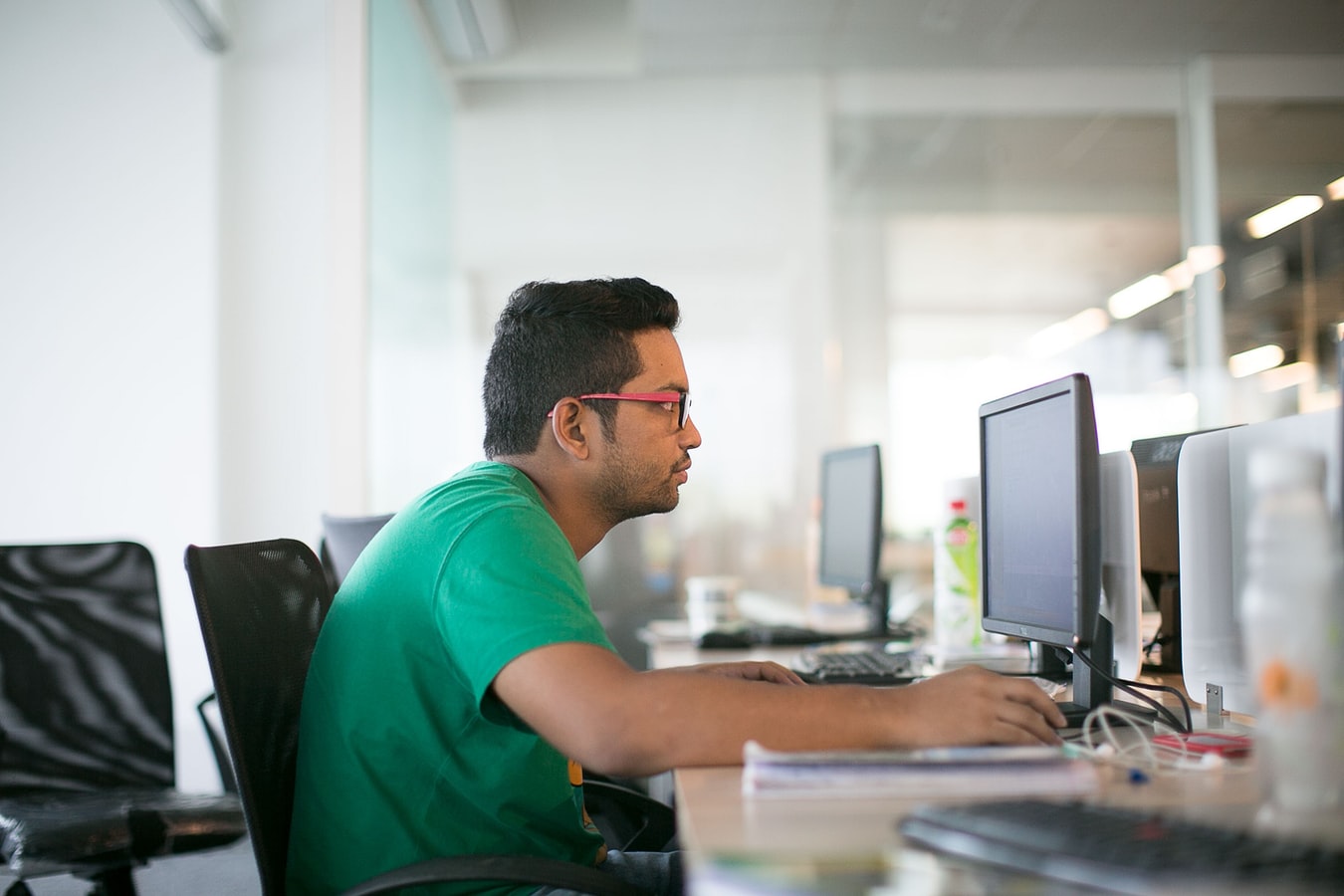 A photo of an office worker in Delhi, India, representing the significant development India's IT sector has seen