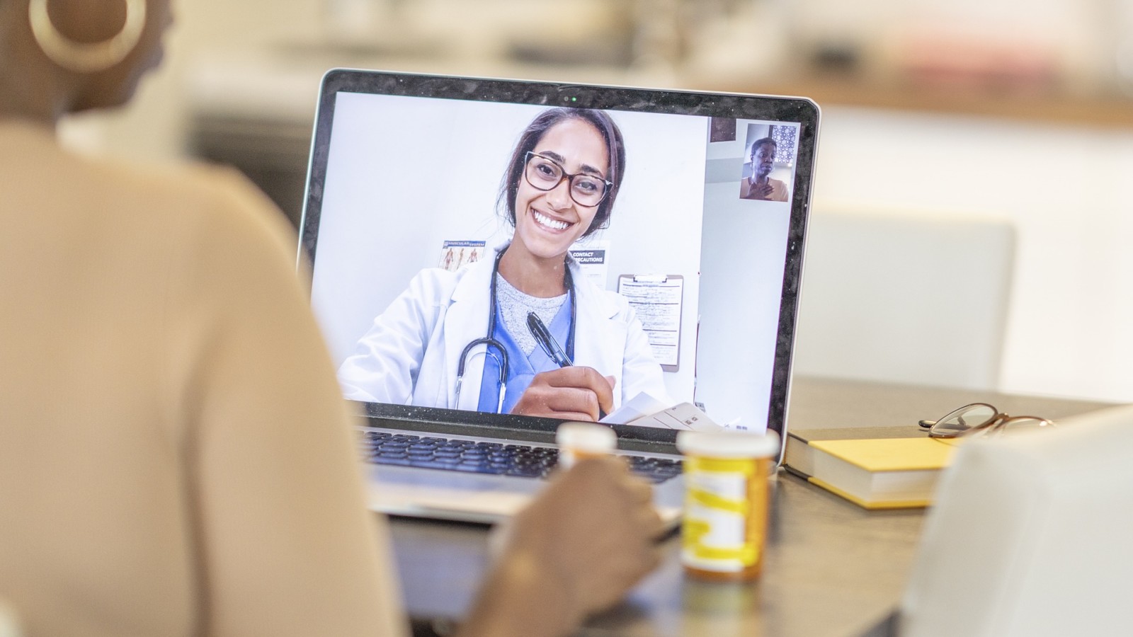 woman speaking with doctor on telehealth appointment