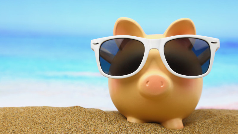 piggy bank wearing sunglasses save money