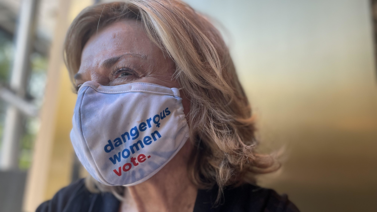 Pat Mitchell wearing her 'Dangerous Women Vote' mask.