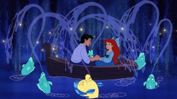A romantic scene between Ariel and Prince Eric in Disney's iconic animated movie, The Little Mermaid