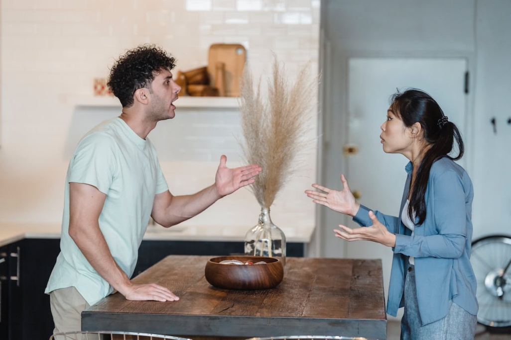 man and woman engaged in heated argument