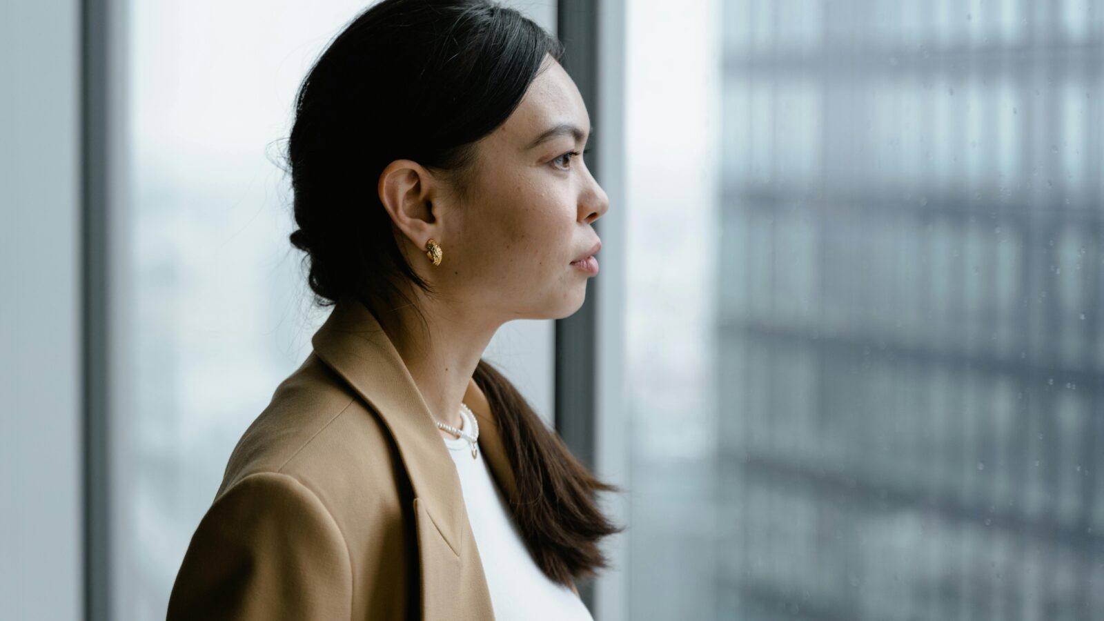 Close Up Shot of a Woman Looking Outside