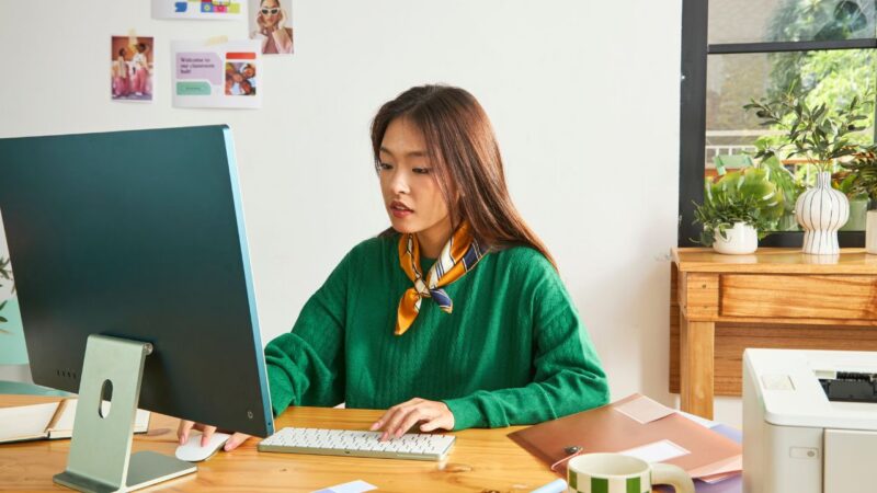 young girl sitting in front of computer learning about the most common email cliches