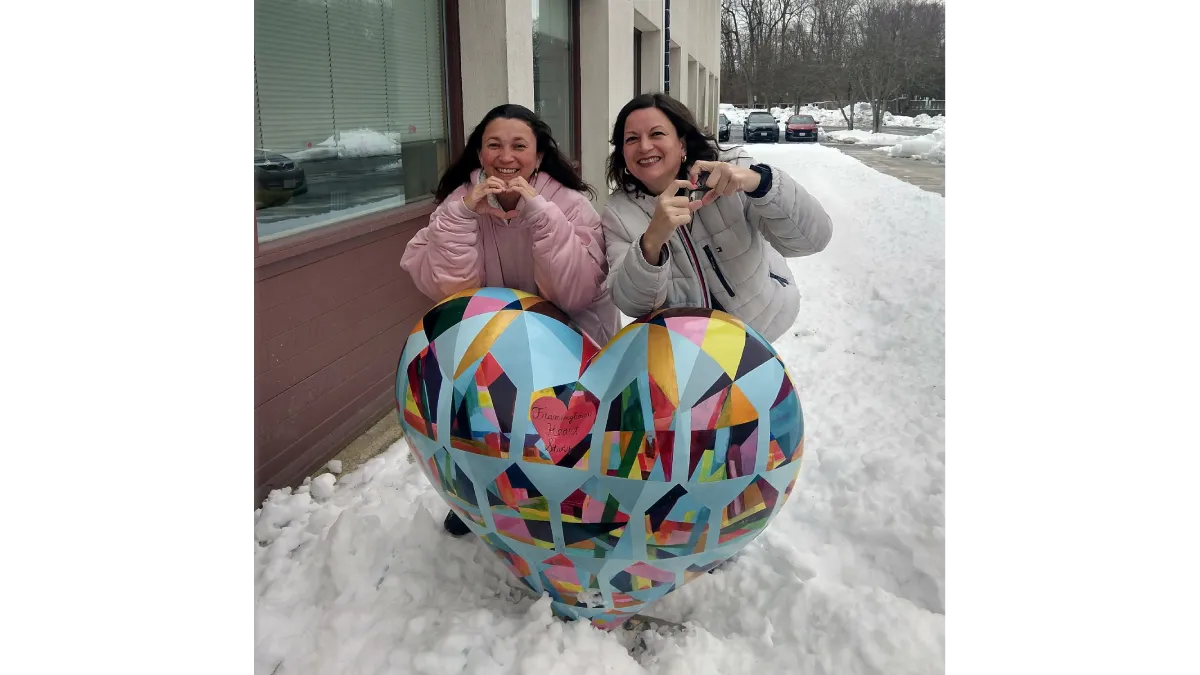 After pulling an all-nighter in a gas station parking lot, Ximena (left) and Monica Martinez (right) were all smiles upon arriving at the headquarters of the Framingham Heart Study. (Courtesy of Monica Martinez)