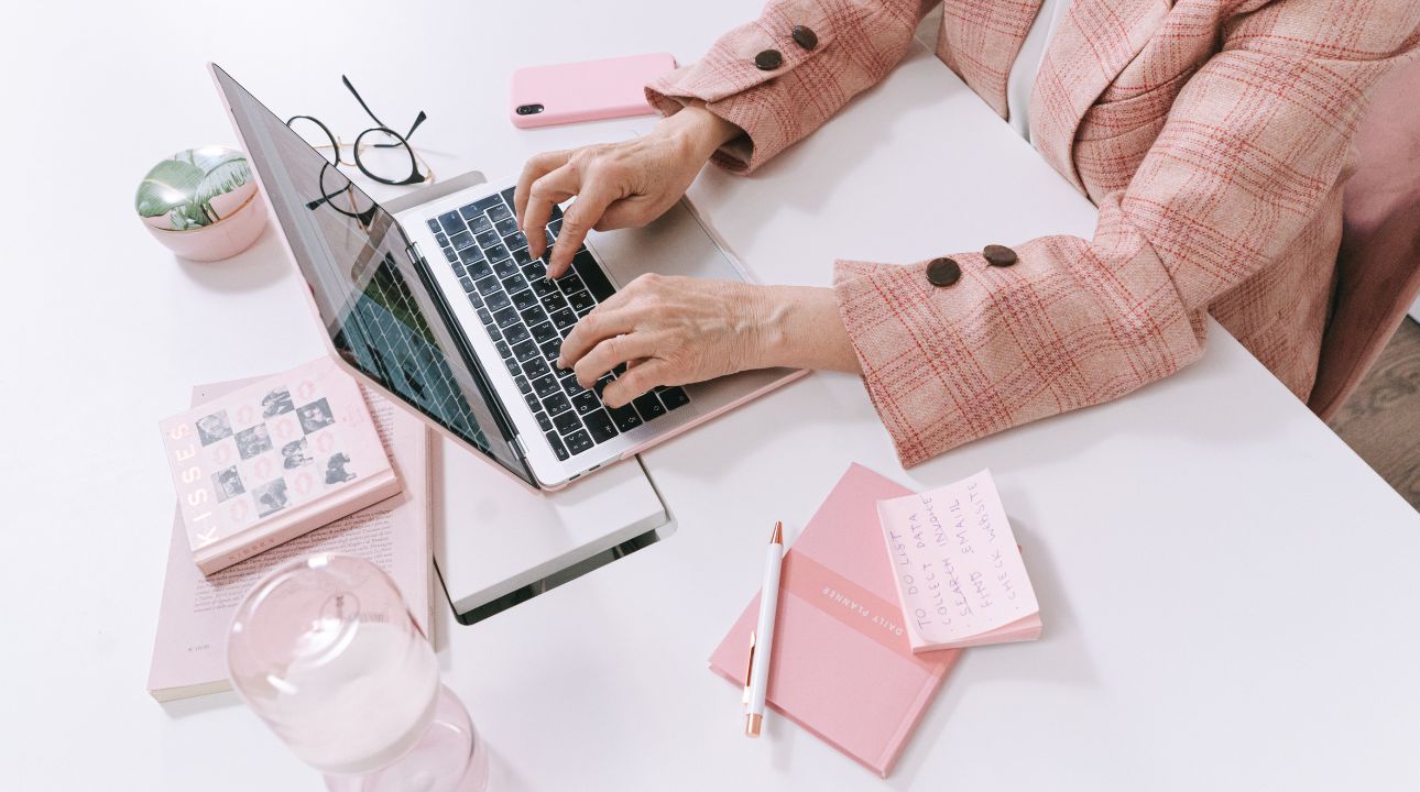 woman's hands showing typing on computer