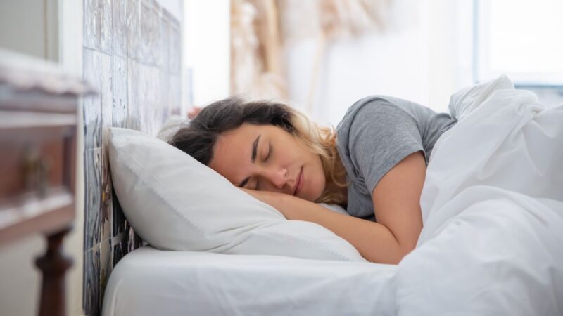 woman sleeping on pillow
