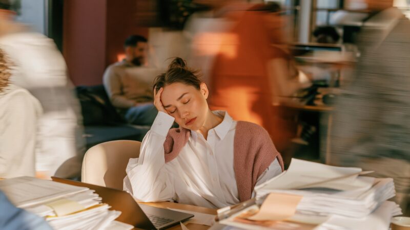 There is a version of career struggle that is easy to recognise. You hate your job. You have a terrible manager. The culture is toxic. You know you need to leave. But there is another version that can be much harder to see. Your career is going well. You’re performing, delivering and probably doing work that, on paper at least, you wanted to be doing. Other people may see you as successful. You may even genuinely like your job and the people you work with. And yet, something isn’t working. You’re tired more often than you’re not. Work occupies far more mental space than you want it to. You find yourself getting through the week and using the weekend to recover, only to start again on Monday. You have less energy for the people and things you care about outside work, and the practices you know support your wellbeing are often the first things to disappear when work gets busy. Nothing is necessarily wrong enough to force a change. But that doesn’t mean everything is right. High performance can hide a lot One of the challenges for capable, high-performing women is that we can continue functioning long after something has stopped being sustainable. We still meet the deadline. We show up for the meeting. We support the team. We respond to the emails, solve the problems and keep everything moving. From the outside, there may be very little indication that anything is wrong because our performance hasn’t changed. And when we’re still performing, it can be easy to convince ourselves that we’re fine. I’ve seen this pattern throughout my own career and in the thousands of women we’ve worked with at Women Rising. We can become so accustomed to carrying a lot that we stop questioning whether we should be carrying it at all. Being busy becomes normal. Being tired becomes normal. Having very little space becomes normal. Sometimes we don’t recognise the cost of the way we’re working until our capacity begins to disappear. Wellbeing isn’t there to make you more productive I think we need to challenge the way wellbeing is often talked about in the workplace. So much of the conversation still positions wellbeing as something we do to help ourselves cope with work. We exercise so we have more energy. We meditate so we can manage stress. We sleep well so we can perform. We take a holiday so we can return refreshed and ready to go again. Of course these practices matter. I’ve built many of them into my own life for decades, and I know how profoundly they can support us. But your wellbeing is not simply another performance strategy. Rest does not have to earn its place by making you more productive. Your health, relationships, joy, energy and life outside work matter in their own right. If every wellbeing practice is simply helping you recover enough to return to an unsustainable way of working, the problem may not be your wellbeing routine. The problem may be the way you’re working. Success has to be sustainable We talk a lot about career success, but not nearly enough about whether the version of success we are creating is one we can actually live with. There will always be intense periods in a career. A major project, a new role, a difficult season, a business challenge or an important opportunity may require more from us for a time. I don’t think every period of pressure is evidence that something is wrong, and I don’t believe the goal is to create a working life without stress or challenge. But there is a difference between a demanding season and a permanent operating model. When every week is the busy week, when the next quieter period never arrives, or when you need your holidays simply to recover enough to continue, it may be worth asking whether the way you’re succeeding is actually sustainable. This is particularly important for women because the demands of work rarely exist in isolation. Many women continue to carry a disproportionate share of caring responsibilities and unpaid work alongside their careers. Add the invisible labour of managing households, relationships, families and other people’s needs, and what looks manageable on an organisational chart can feel very different in a woman’s actual life. Wellbeing cannot be separated from the context in which we are trying to work and lead. Sometimes the problem isn’t your workload There are times when the obvious answer is that there is simply too much work. But workload isn’t always the whole story. Sometimes what exhausts us is the way we relate to our work. Perfectionism can turn a task that needs to be good into one that has to be exceptional. People pleasing can make every request feel difficult to refuse. Overachieving can keep us taking on more long after we have enough on our plates. A strong sense of responsibility can leave us carrying problems that don't actually belong to us. Then there are the habits that become almost invisible over time: checking email late at night, being constantly available, saying yes before checking our capacity, filling every gap in the day, or believing that being indispensable is evidence of our value. This is why another productivity tool isn’t always the answer. Sometimes becoming more efficient simply allows us to fit even more into a life that is already too full. The more useful work may be understanding what is driving the way we work in the first place. Your boundaries tell people what is sustainable Boundaries are often discussed as though they are simply about learning to say no. They are much more nuanced than that. They are about becoming clear on what you can reasonably give, what matters most, and what you are no longer willing to sacrifice in order to meet every expectation around you. That might mean changing when you are available, having a conversation about workload, asking for support, delegating rather than automatically doing something yourself, allowing someone else to be disappointed, or deciding that good enough really is good enough in places where perfection isn't required. None of this means becoming less committed to your work. In my experience, sustainable boundaries often allow women to contribute more meaningfully because their energy isn't being consumed by everything at once. But boundaries require us to tolerate something many high-achieving women find difficult: the possibility that we won't always be able to meet everyone's expectations. That can be uncomfortable. It can also be necessary. Your career is only one part of your life This may sound obvious, but it is remarkably easy to forget when work becomes consuming. A meaningful career can be an enormously important part of a meaningful life. I believe deeply in women's ambition, leadership and contribution, and I don't think we need to diminish those things in order to care about our wellbeing. But the career should fit within the life, not consume it. There may be seasons when you willingly give more to your work because what you're building matters deeply to you. There may also be seasons when other parts of your life need more of you. Neither has to become a permanent identity or a judgment about how ambitious you are. What matters is that you're making those choices consciously rather than waking up one day to discover that work has gradually expanded into every available space. So if your career appears to be working but you don't feel as though you are, I wouldn't immediately ask how you can become more resilient or better at managing everything. I'd start somewhere else. Is the way I'm working allowing me to have the life I want as well as the career I want? And if the answer is no, perhaps the next step isn't finding a better way to cope with what you're carrying. Perhaps it's deciding what you no longer need to carry. If wellbeing and resilience are the areas that need your attention right now, Wellbeing & Resilience is one of the individual Women Rising Program modules now available through The Career Studio by Women Rising. It will help you understand the patterns affecting your energy and wellbeing, create stronger boundaries, and build practical strategies for working and leading in a way that is more sustainable. Because a successful career shouldn't require you to disappear from the rest of your life. - Women Rising